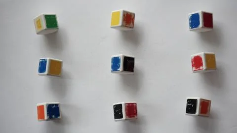 Separate elements of a rubik's cube on a white surface Foto stock