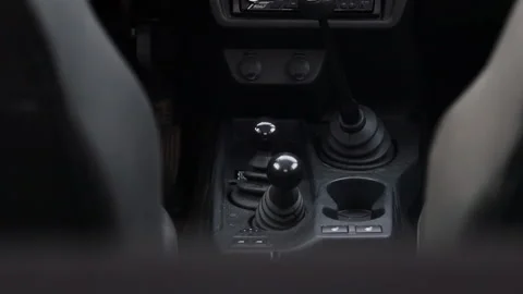 Separate shift lever for off-road vehicle functions. lowered range of gears. low Stockbeeldmateriaal 168103122