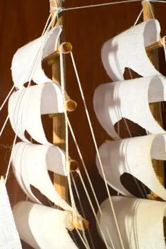Separate white sails of the ship model. Closeup Stock Photos