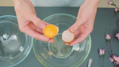 Separate the yolk from the proteins Stock Footage 252398591
