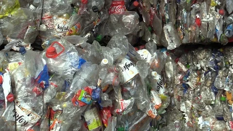 Separated and pressed transparent plastic bottles package ready for recycling Stock Footage 89475298