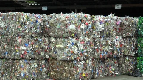 Separated and pressed transparent plastic bottles package ready for recycling Stock Footage 90223826