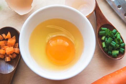 Separated egg white with Scallion and carrot Stock Photos