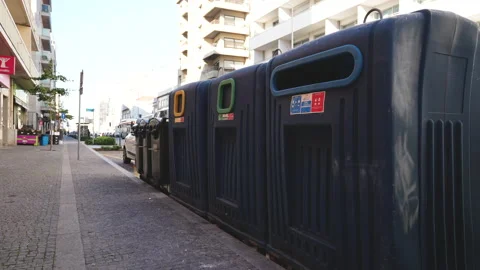 Separated garbage disposing bins. Plastic cans for glass, metal, paper, organics Stock Footage 166544078