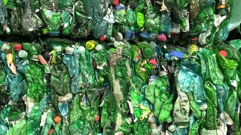 Separated pressed green and transparent plastic bottles package for recycling Stock Footage 89473181