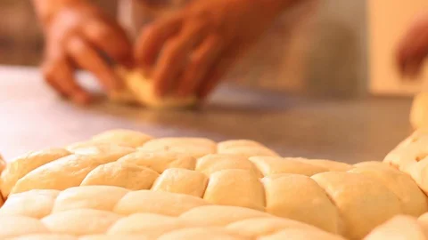Separating and making small lumps of dough to make bread / Mexican sweet bread Stock Footage 130087370