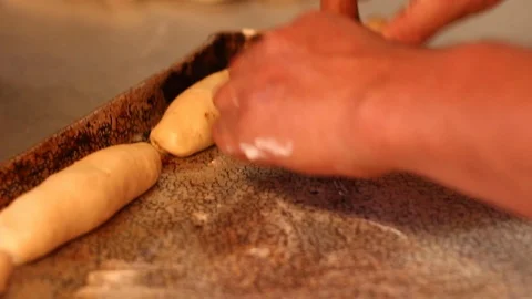 Separating and making small lumps of dough to make bread / Mexican sweet bread Stock Footage 130087418