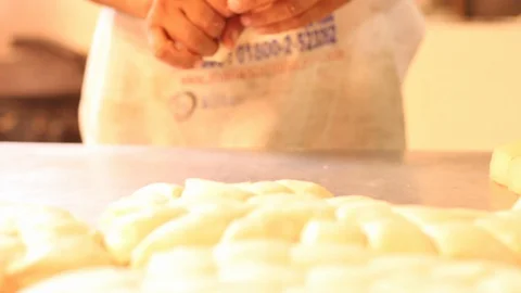 Separating and making small lumps of dough to make bread  02 Stock Footage 130087431