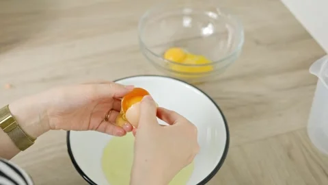 Separating Egg Yolk and White for Tiramisu Preparation Process Stock Footage 312245069