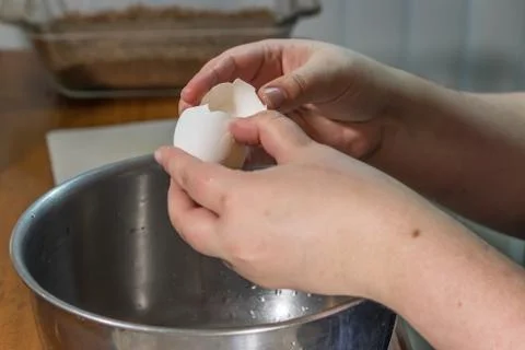 Separating egg yolk with shells 写真素材