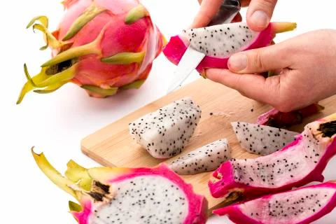 Separating pitaya fruit pulp from its skin Stock Photos