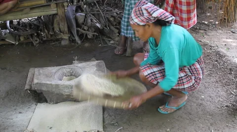 Separating rice from hulls and husks through hand sifting Stock Footage 68144640