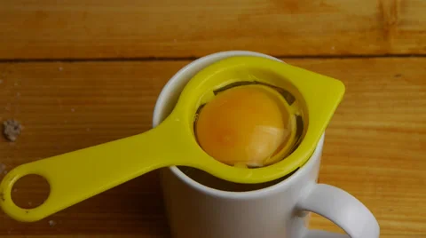 Separating the yolk and egg white Stock Footage 33941999