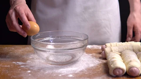 Separation of egg yolk from protein. close up Video stock 111770374