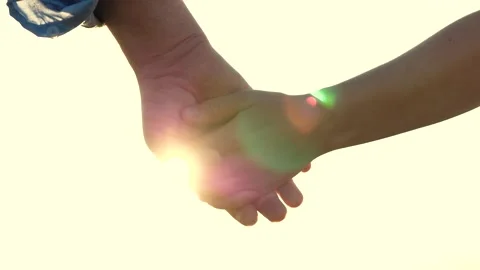 Separation two loving people. sunset through fingers. sign symbol goodbye Stock Footage 246958808