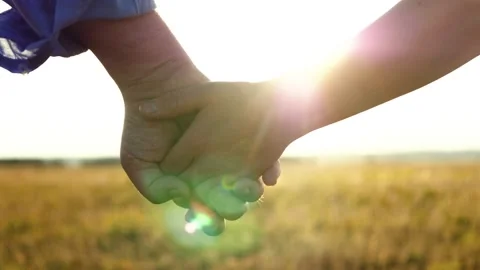 Separation two loving people. sunset through fingers. sign symbol goodbye Stock Footage 247499553