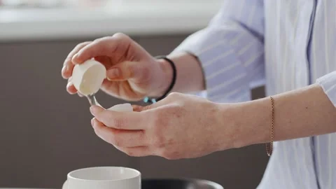 Separation of the yolk from the protein in close-up. Stock Footage 147330990