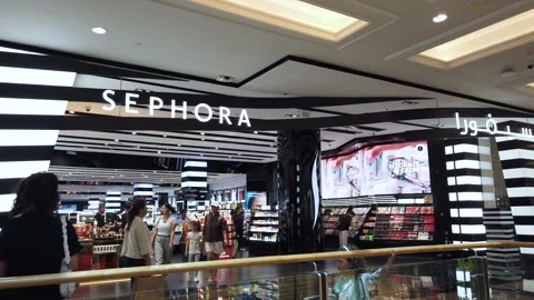 Sephora cosmetics store inside a Dubai shopping mall, displaying vibrant beau Video stock 312334628