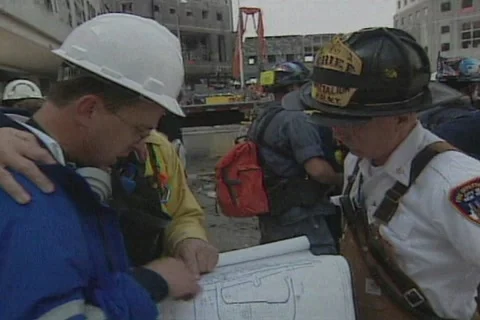 September 11  2001 Attacks on World Trade Center - Looking at blue prints Part F Stock Footage 248923613