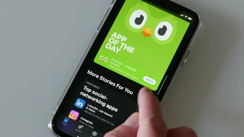 SEPTEMBER 12, 2023: Using the App Store on an iPhone, Close-up Stock Footage 250091784
