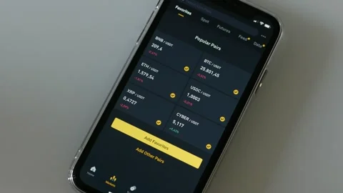 SEPTEMBER 12, 2023: Using Binance App on an iPhone, Close-up Stock Footage 250091744