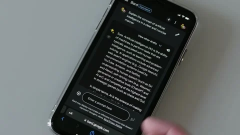 SEPTEMBER 12, 2023: Using Google Bard, Generative AI, on an iPhone Video stock 250092054