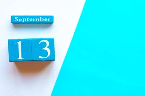 September 13, empty blue and white geometric background. Wooden handmade cale Stock Photos