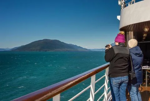 September 14, 2018 - Inside Passage, AK: Cruise travelers photographing scene Stock Photos