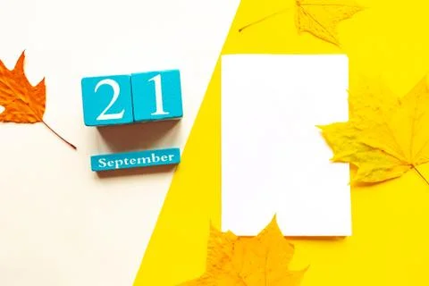 September 21, empty yellow and white geometric background. Wooden handmade ca Stock Photos