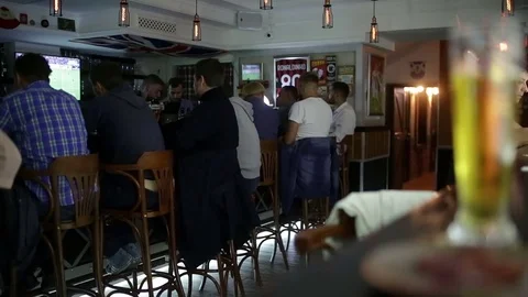 September 23, 2016 Dnepr, opening a new pub, people celebrate and watch football Stock Footage 70793082