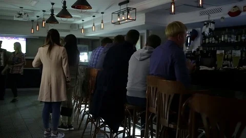 September 23, 2016 Dnepr, opening a new pub, people celebrate and watch football Stock Footage 70794097