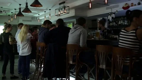 September 23, 2016 Dnepr, opening a new pub, people celebrate and watch football Stock Footage 70794422