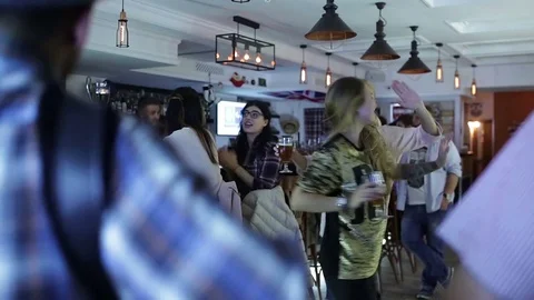 September 23, 2016 Dnepr, opening a new pub, people celebrate and watch football Stock Footage 70794551