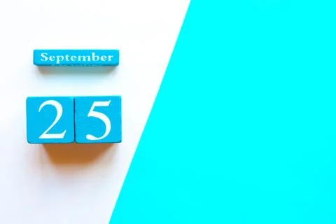 September 25, empty blue and white geometric background. Wooden handmade cale Stock Photos