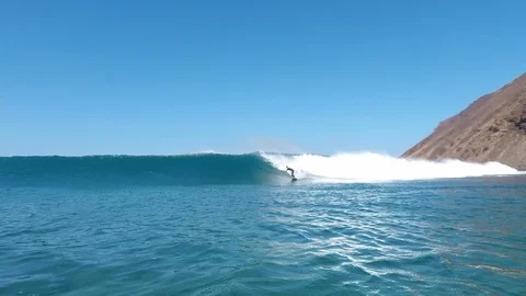 September 29,2019: surfer riding waves on the island of fuerteventura Stock Footage 126531310