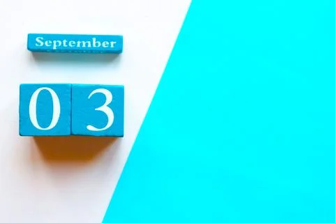 September 3, empty blue and white geometric background. Wooden handmade calen Stock Photos