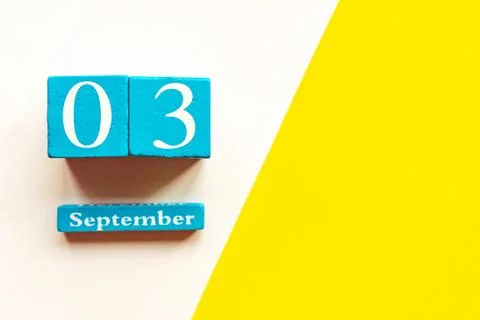 September 3, empty yellow and white geometric background. Wooden handmade cal Stock Photos