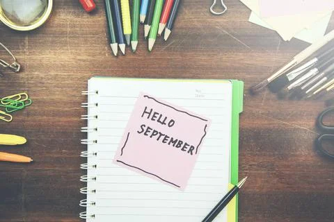 September text on notepad with stationary Stock Photos