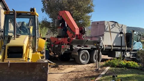 Septic Delivery and Backhoe Stock Footage 174860685