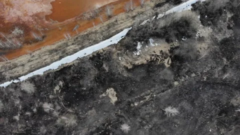 Septic lakeDrone flight of red mud lake nearby old aluminum factory. Stock Footage 106296088