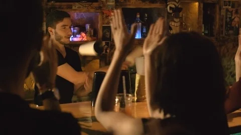 Sequence of Bartender Entertaining Multiethnic Customers Stock Footage 110723756