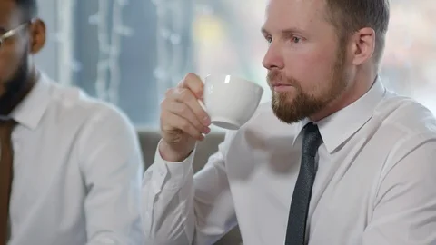 Sequence of Business People Drinking Coffee and Talking on Lunch 動画素材 102864000