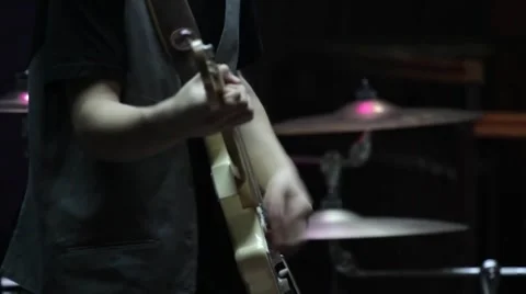 Sequence of a concert. A boy playing the guitar, then the frame is focused Stock Footage 59667739