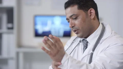 Sequence Of Doctor Showing How To Stretch Wrist Stock-Footage 139603415
