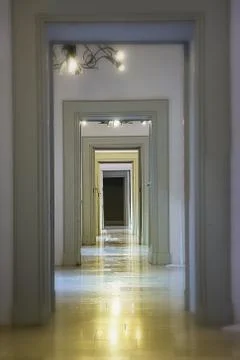 Sequence of endless doors and marble floor 스톡 사진