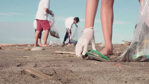 Sequence Of Environmentalists Cleaning Up Beach 動画素材 142683127
