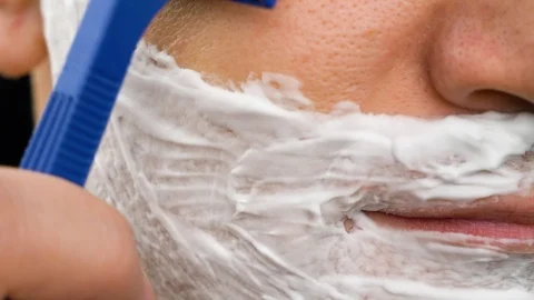 Sequence of few shots man shaving with different manual razors and foam Stock Footage 102119922