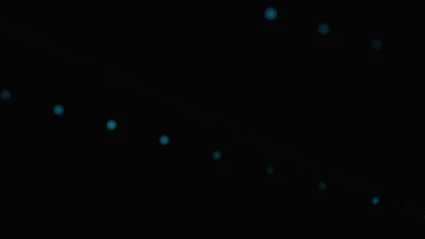 A sequence of glowing blue circular lights arranged on a dark background 스톡 동영상 339617854