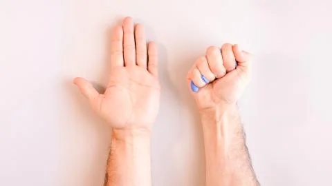 Sequence of images in which a man's hands taking off blue disposable gloves m Stock Photos