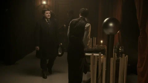 Sequence of Nikola Tesla demonstrating his invention of electricity flows betwee Stockbeeldmateriaal 236630145